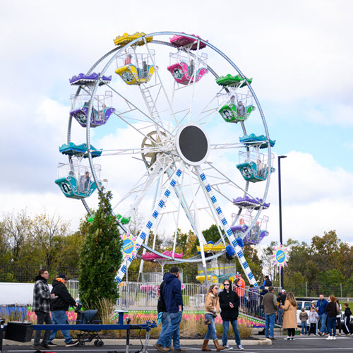 TQL employees and their families enjoy carnival rides, games, food and fall activities at the fourth annual Fall Fest at company headquarters Oct. 17, 2026.