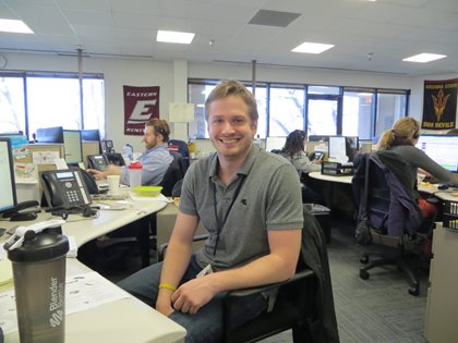 Man Smiling at desk