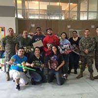 TQL Bolsters Toys For Tots Efforts