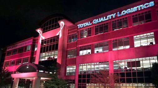 TQL building with projected breast cancer ribbons