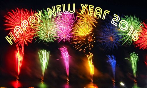 Colorful Fireworks Going Off Behind A New Years Message