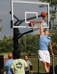Man dunking basketball