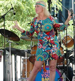 Woman on stage with 70s inspired outfit