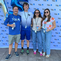 TQL Charleston team celebrating at a patio party with food, games, and camaraderie