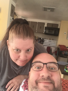 Adam and his wife at home
