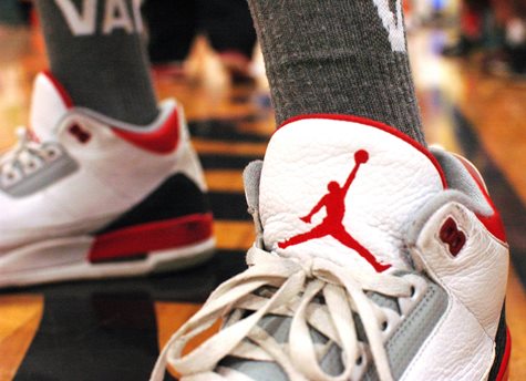 A Closeup Of Red, White, And Black Basketball Shoes