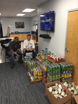 Two men with canned goods