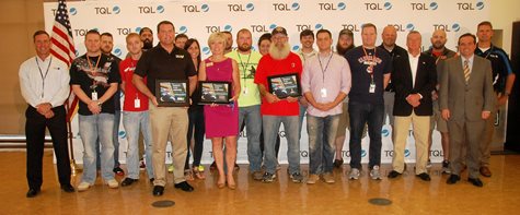 Group Of TQL Employees Smiling With The Mayor Of Cincinnati And Three Plaques