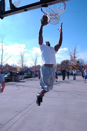 Man dunking basketball