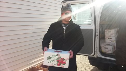 Man loading truck with boxes