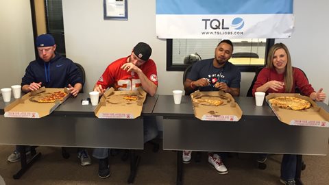 Four Employees Individually Eating An Entire Pizza For A Contest