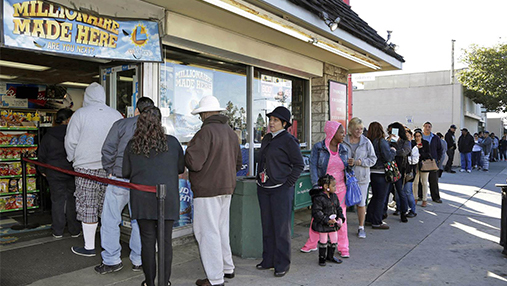 Line Of People Waiting Behind A Sign That Says Millionaire Made Here