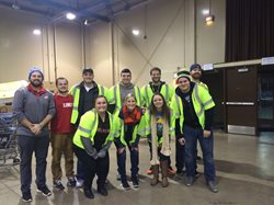 People in safety vest posing for a picture