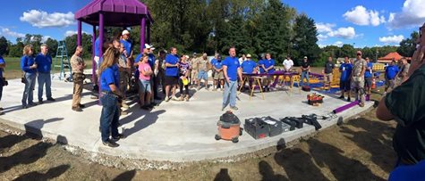 A Group Of People Getting Ready To Build A Playground For Community Service