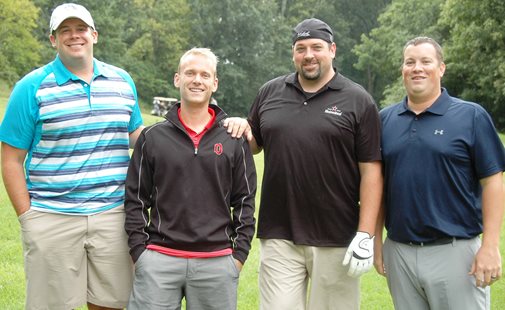 People posed on golf course