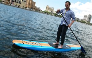 Man paddle boarding on body of water